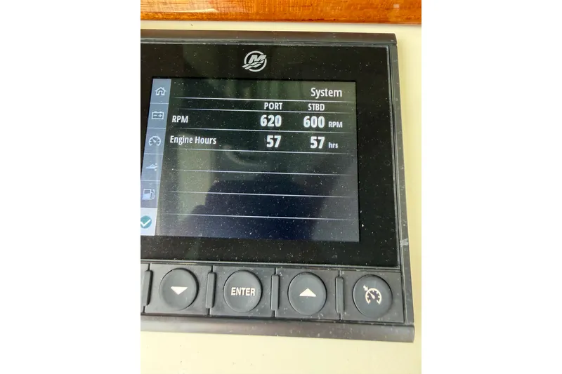Slide: The Image of Display panel of 2024 Chris-Craft Catalina 30 showing RPM and engine hours. - 10