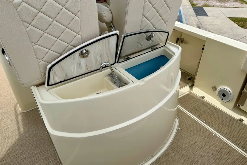 Slide: The Image of 2024 Chris-Craft Catalina 30 boat interior with dual storage compartments and luxurious seating. - 11