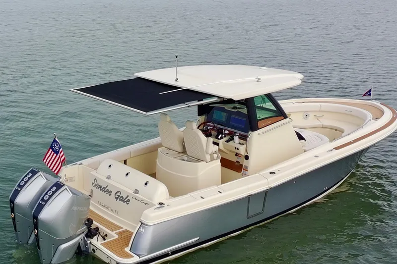 Slide: The Image of 2024 Chris-Craft Catalina 30 boat on water, featuring dual engines and elegant design. - 2