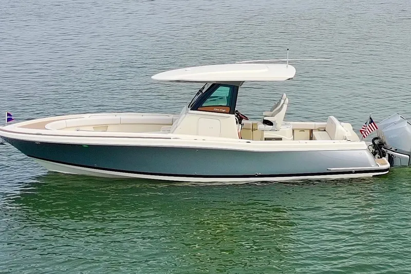 Slide: The Image of 2024 Chris-Craft Catalina 30 boat on calm water, showcasing sleek design and modern features. - 20