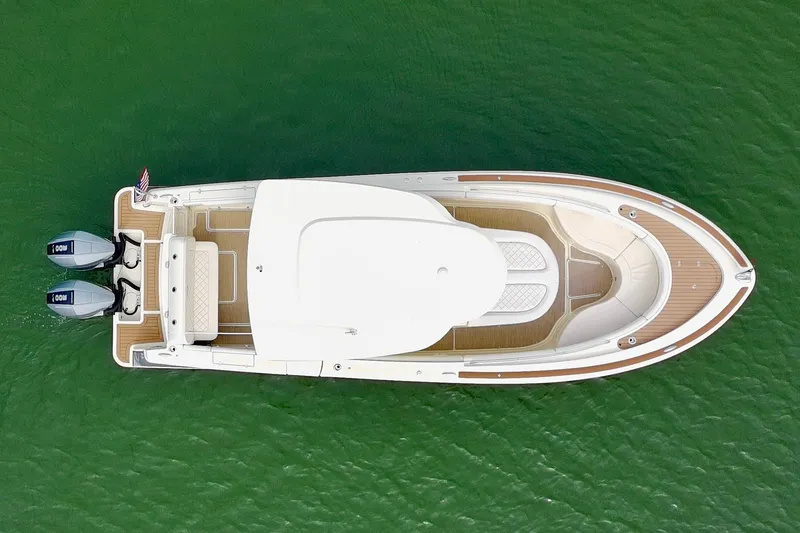 Slide: The Image of 2024 Chris-Craft Catalina 30 boat, aerial view, on green water. - 21