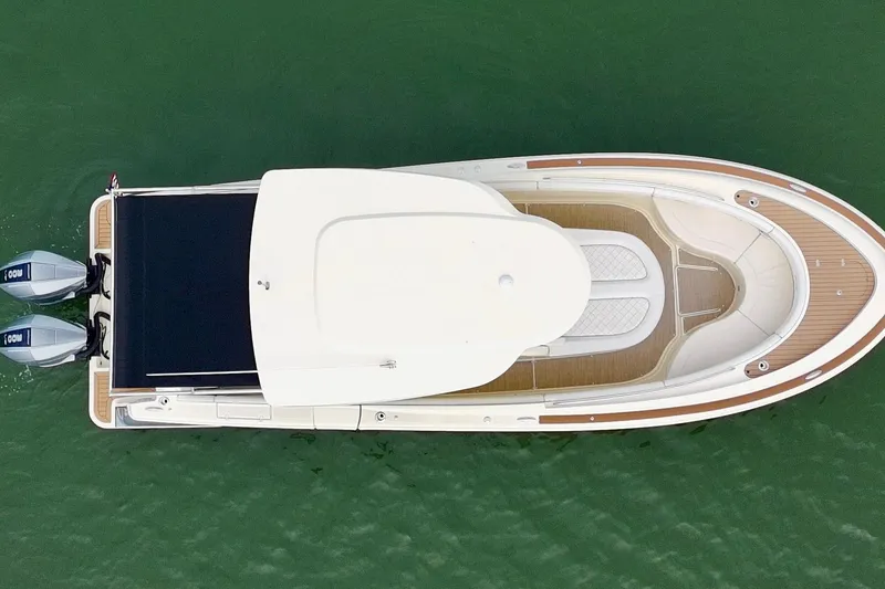 Slide: The Image of Aerial view of 2024 Chris-Craft Catalina 30 boat on green water. - 22