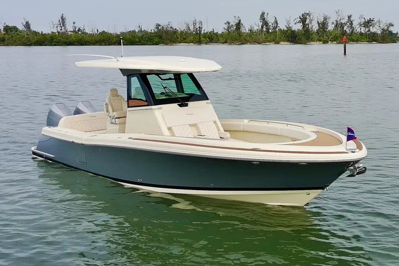 Slide: The Image of 2024 Chris-Craft Catalina 30 boat on calm water, showcasing sleek design and luxury features. - 25