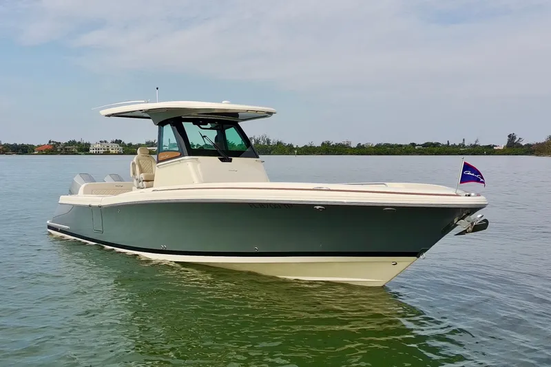 Slide: The Image of 2024 Chris-Craft Catalina 30 boat on calm water, showcasing sleek design and luxury features. - 26