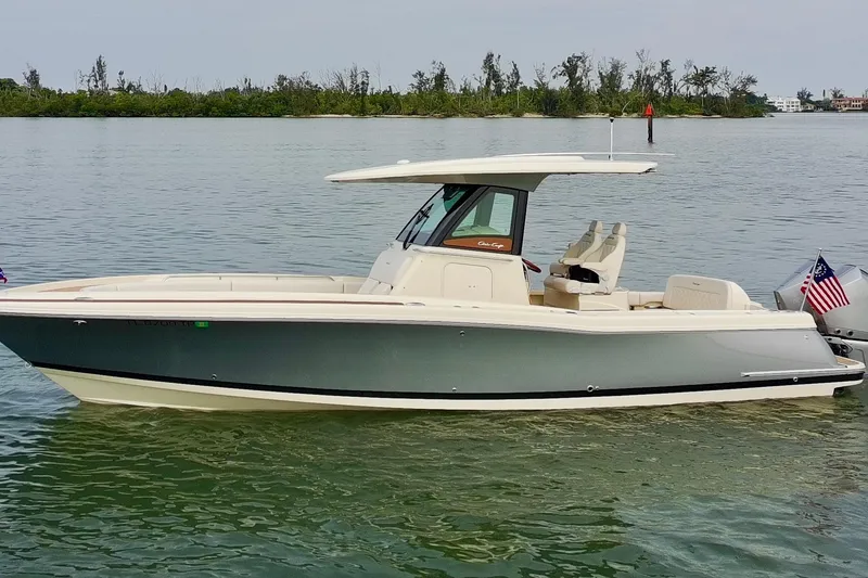 Slide: The Image of 2024 Chris-Craft Catalina 30 boat on calm water, featuring sleek design and modern amenities. - 27