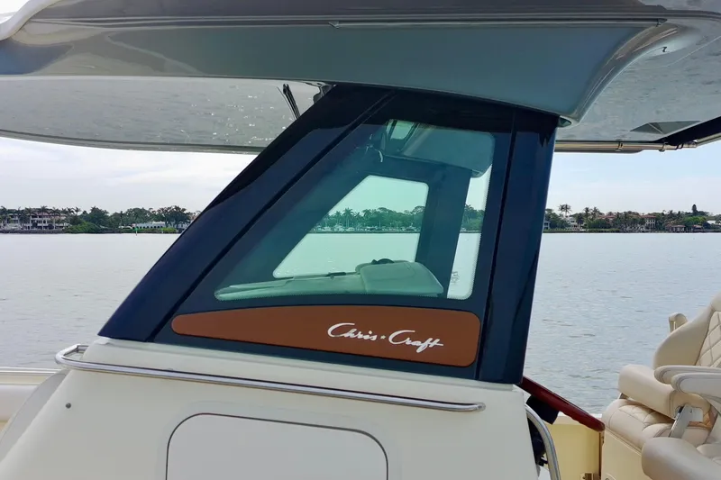 Slide: The Image of 2024 Chris-Craft Catalina 30 boat with sleek design on calm waters. - 28