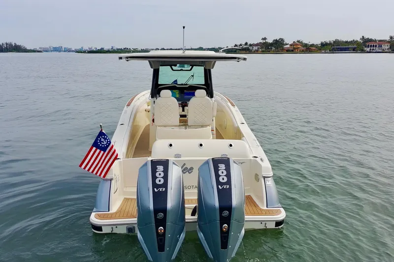 Slide: The Image of 2024 Chris-Craft Catalina 30 boat with dual 300 V8 engines on calm water. - 32