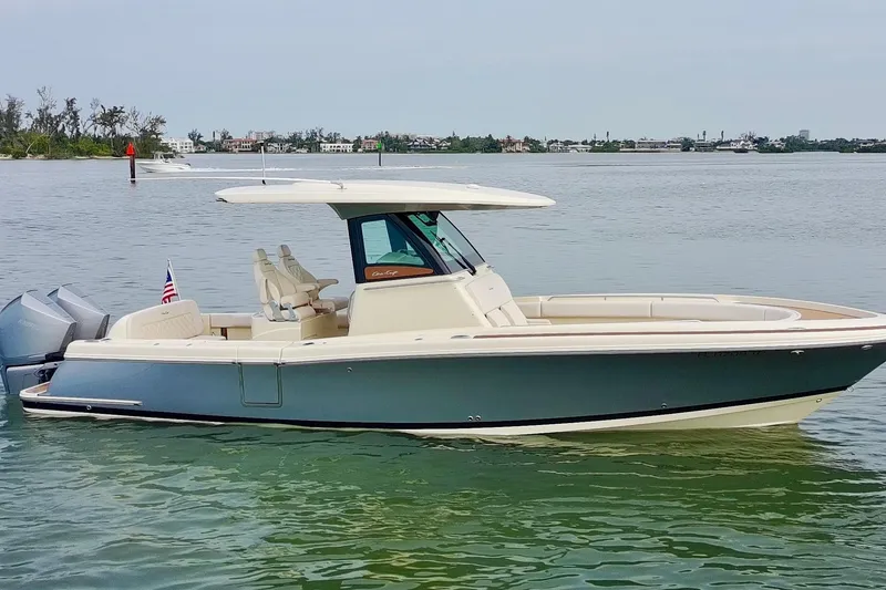 Slide: The Image of 2024 Chris-Craft Catalina 30 boat on calm water, showcasing sleek design and luxury features. - 34