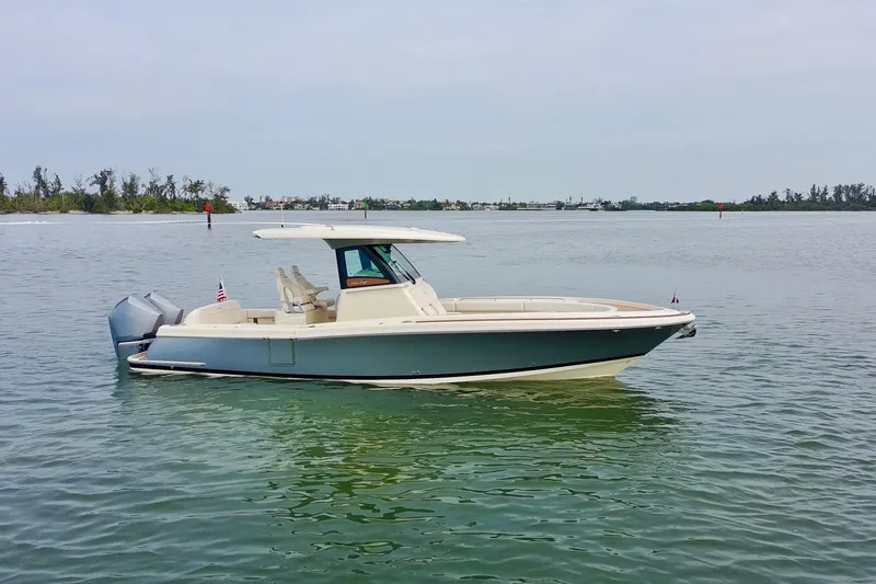 Slide: The Image of 2024 Chris-Craft Catalina 30 boat on calm water, side view. - 37