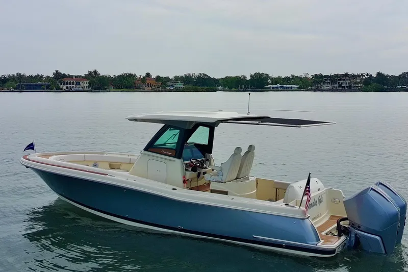Slide: The Image of 2024 Chris-Craft Catalina 30 boat on calm water, showcasing sleek design and modern features. - 39
