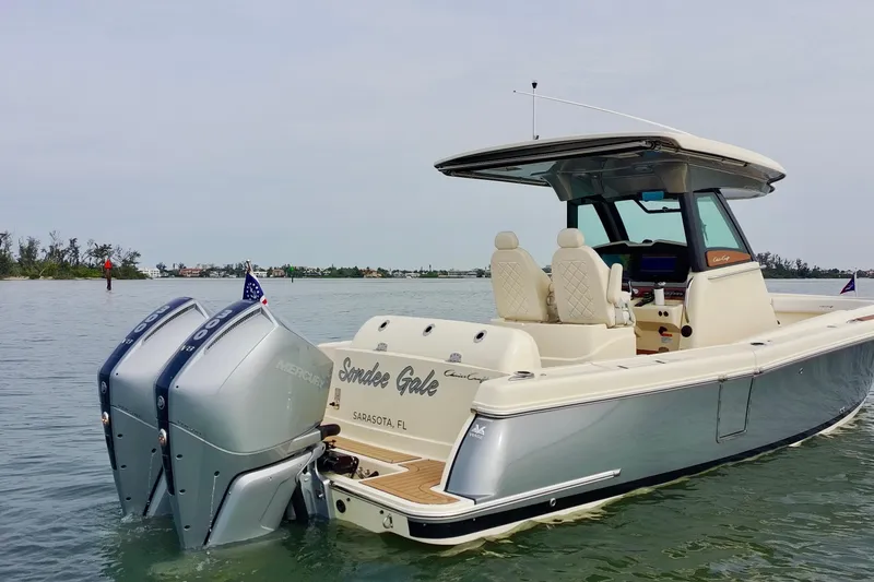 Slide: The Image of 2024 Chris-Craft Catalina 30 boat with dual Mercury engines on calm water. - 4