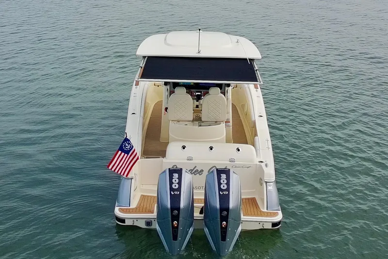 Slide: The Image of 2024 Chris-Craft Catalina 30 boat with dual 300 V8 engines on calm water. - 40