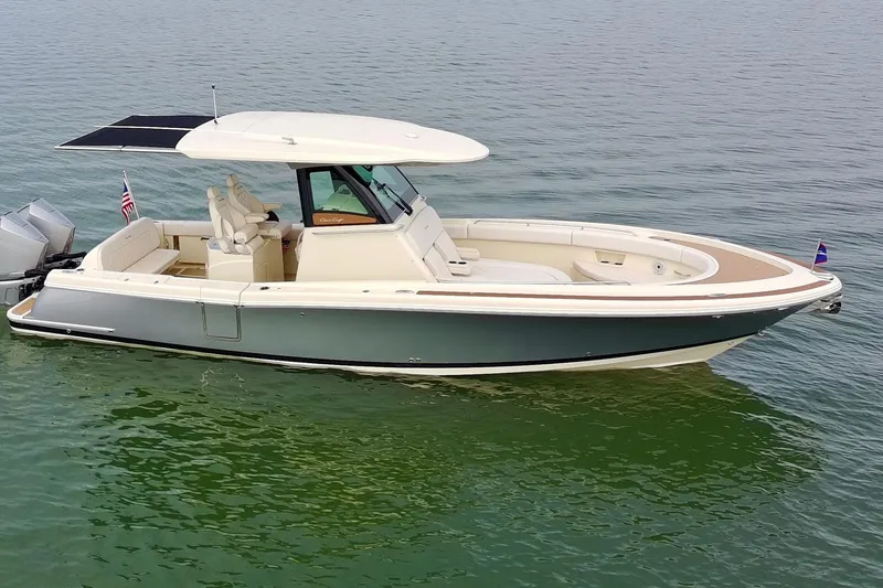 Slide: The Image of 2024 Chris-Craft Catalina 30 boat on calm water, showcasing sleek design and luxury features. - 41