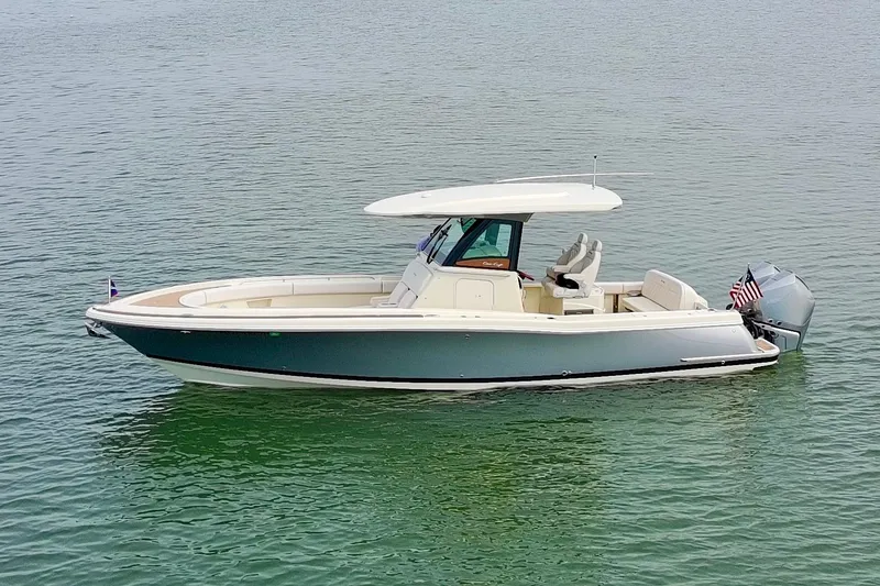Slide: The Image of 2024 Chris-Craft Catalina 30 boat on calm water, side view. - 42