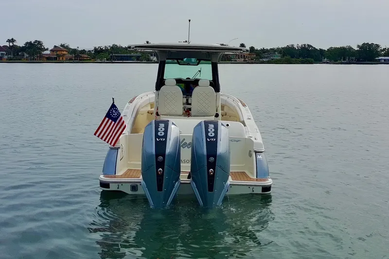 Slide: The Image of 2024 Chris-Craft Catalina 30 with dual 300 V8 engines on calm water. - 44