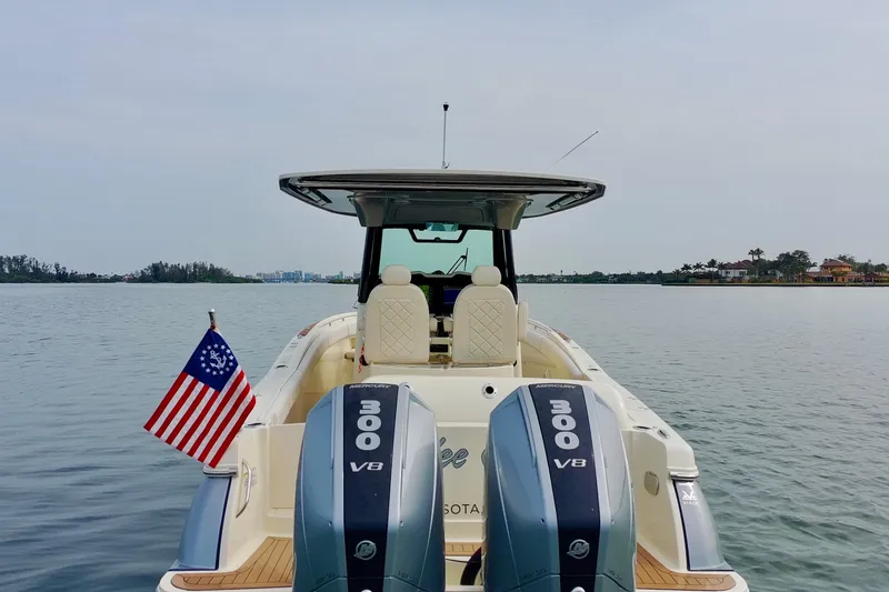 Slide: The Image of 2024 Chris-Craft Catalina 30 boat with dual Mercury 300 V8 engines on calm water. - 45