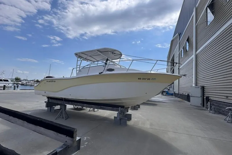 The Image of 2008 Sea Fox 256 Center Console boat on dry dock near marina. - 3