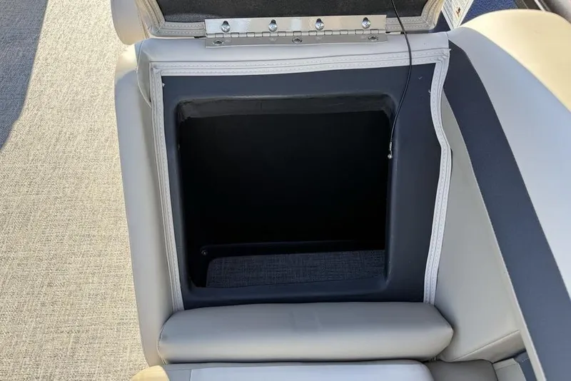 Slide: The Image of Open storage compartment in 2026 Premier 220 Sunscape RF XLC boat seat. - 28