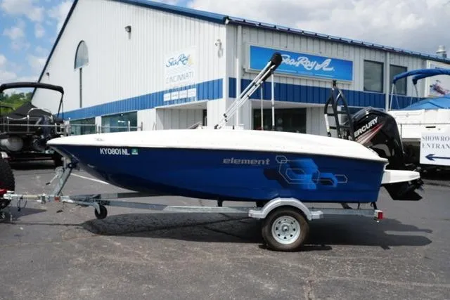 The Image of 2019 Bayliner Element 160 boat on trailer outside dealership. - 1