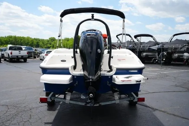 Slide: The Image of 2019 Bayliner Element 160 boat on trailer, rear view, in parking lot. - 6
