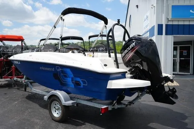 Slide: The Image of 2019 Bayliner Element 160 boat with Mercury engine on trailer, parked outside dealership. - 7