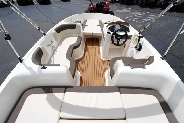 Slide: The Image of 2019 Bayliner Element 160 boat interior with seating and steering console. - 8