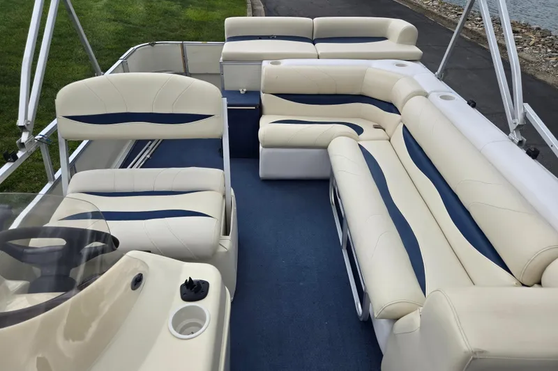 Slide: The Image of 2004 Odyssey Pontoons 2302 Millennium interior with spacious seating and elegant design. - 15
