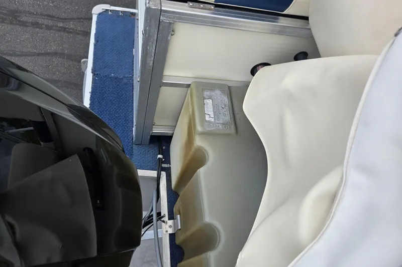 Slide: The Image of 2004 Odyssey Pontoons 2302 Millennium interior with blue carpet and white seating. - 17