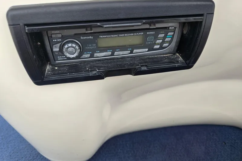Slide: The Image of Close-up of a Seaworthy FM/AM electronic tuner CD player in a 2004 Odyssey Pontoons 2302 Millennium. - 23