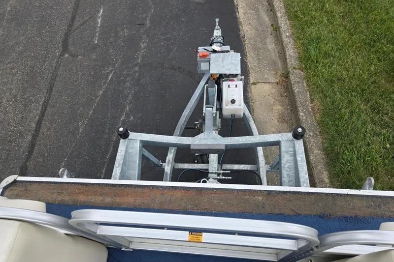 Slide: The Image of Top view of a 2004 Odyssey Pontoons 2302 Millennium trailer hitch on pavement. - 25
