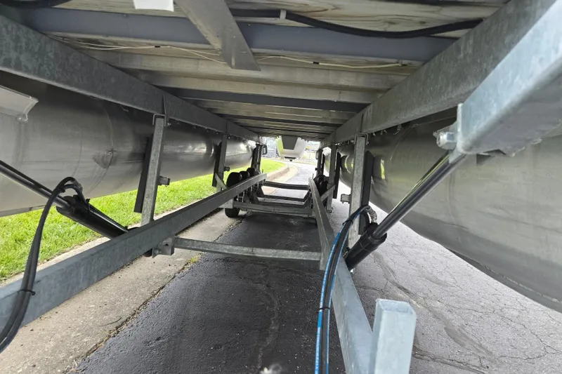 Slide: The Image of Underneath view of a 2004 Odyssey Pontoons 2302 Millennium boat trailer. - 7
