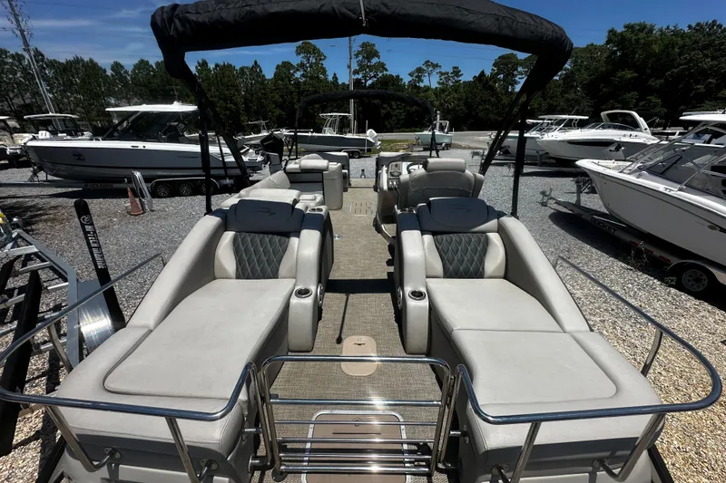 Slide: The Image of 2019 Bennington QX 25 Stern Lounge pontoon boat with luxurious seating and canopy. - 9