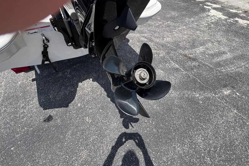 Slide: The Image of Propeller of a 2025 Boston Whaler 130 Super Sport boat on pavement. - 21