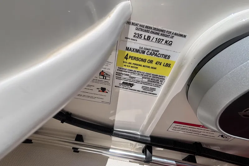 Slide: The Image of 2025 Boston Whaler 130 Super Sport capacity label, showing maximum weight and passenger limits. - 39