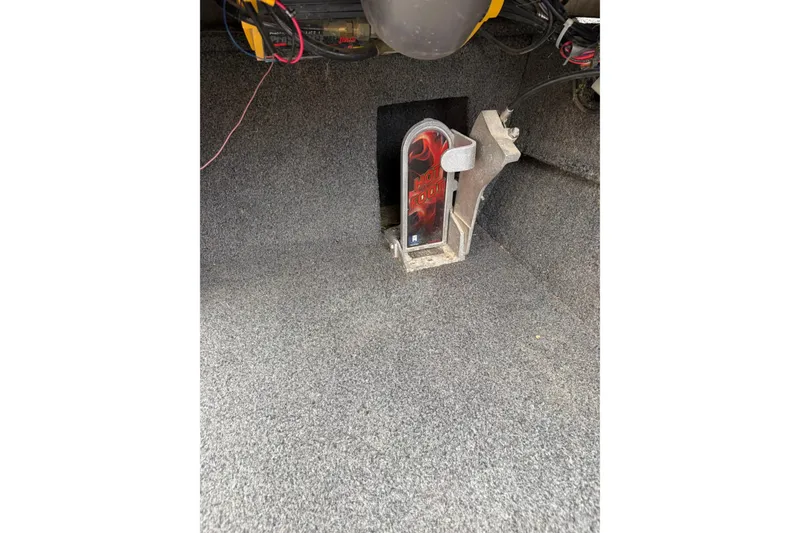 Slide: The Image of Interior of a 2018 Polarcraft TX 195 boat showing a foot pedal and wiring. - 17