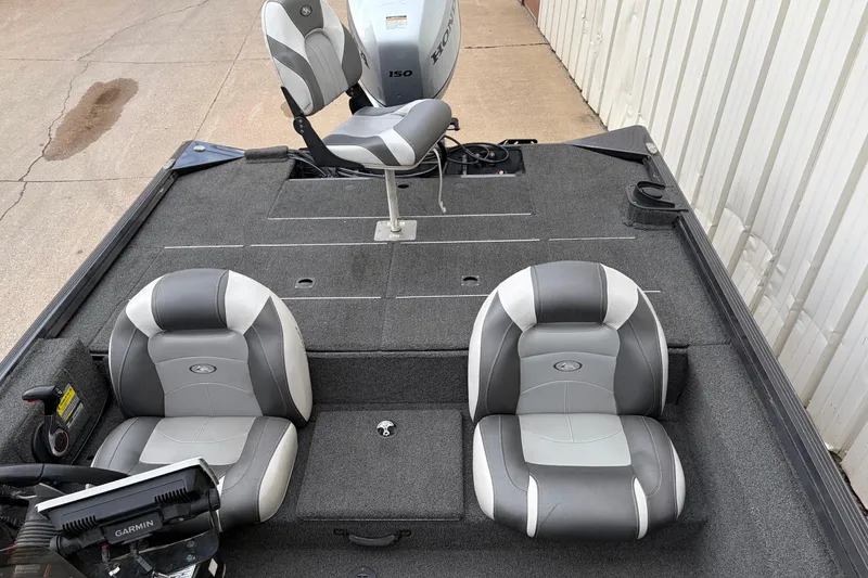 Slide: The Image of 2018 Polarcraft TX 195 boat interior with gray seating and Garmin equipment. - 22