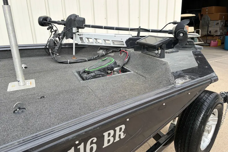 Slide: The Image of 2018 Polarcraft TX 195 boat with trolling motor and navigation system, parked on a trailer. - 23