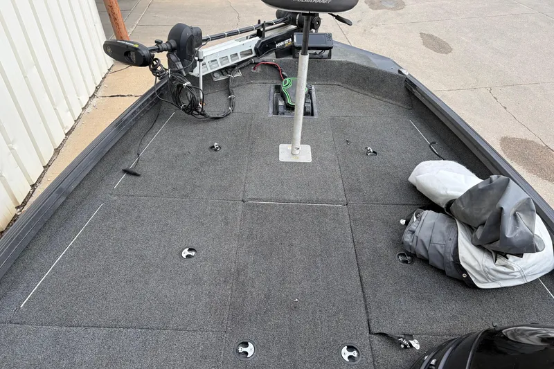 Slide: The Image of 2018 Polarcraft TX 195 boat deck with trolling motor and storage compartments. - 25