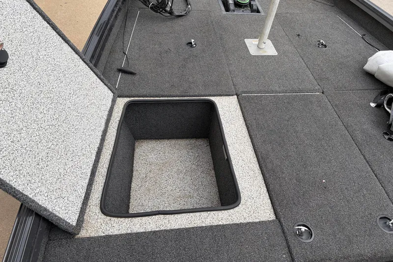Slide: The Image of Open storage compartment on 2018 Polarcraft TX 195 boat deck. - 27
