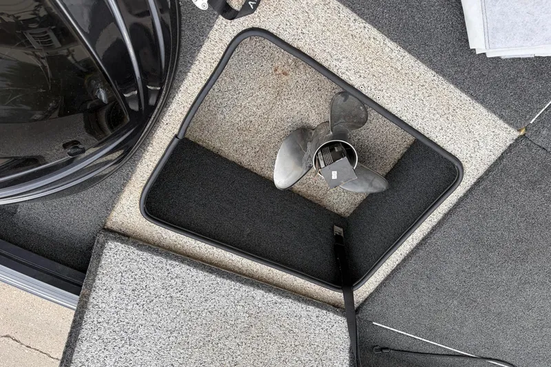 Slide: The Image of Storage compartment with propeller in 2018 Polarcraft TX 195 boat. - 28