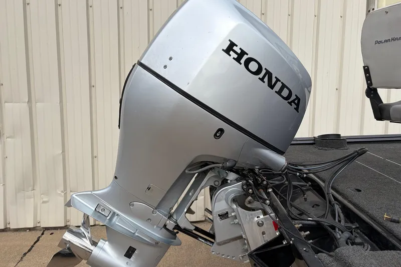 Slide: The Image of 2018 Polarcraft TX 195 boat with Honda outboard motor, side view. - 3