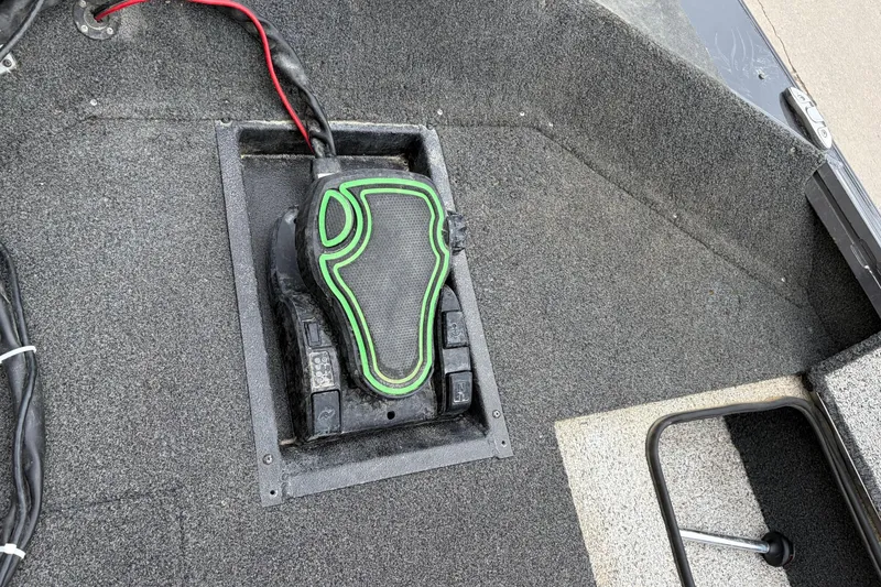Slide: The Image of Foot pedal control on 2018 Polarcraft TX 195 boat deck, featuring green accents. - 32