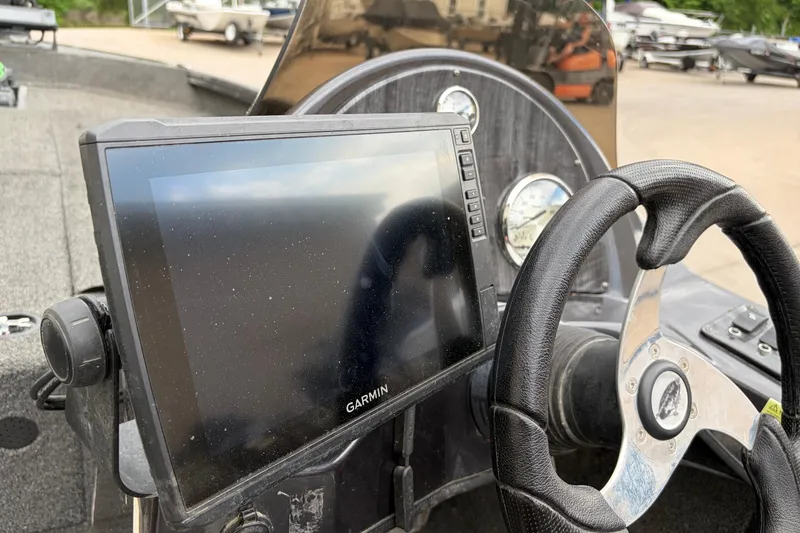 Slide: The Image of 2018 Polarcraft TX 195 boat dashboard with Garmin display and steering wheel. - 8