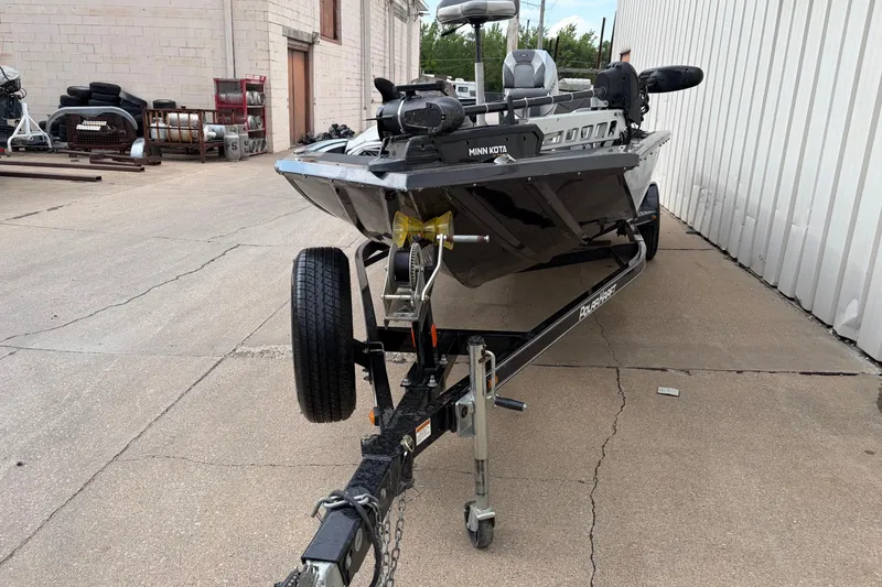 Slide: The Image of 2018 Polarcraft TX 195 boat on trailer, parked outdoors near a building. - 9
