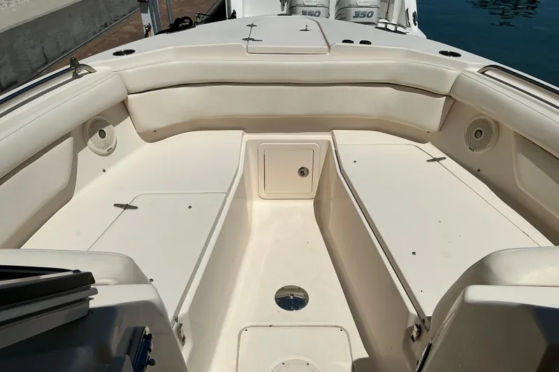 Slide: The Image of 2018 Grady-White Freedom 285 boat interior with spacious seating and storage compartments. - 1