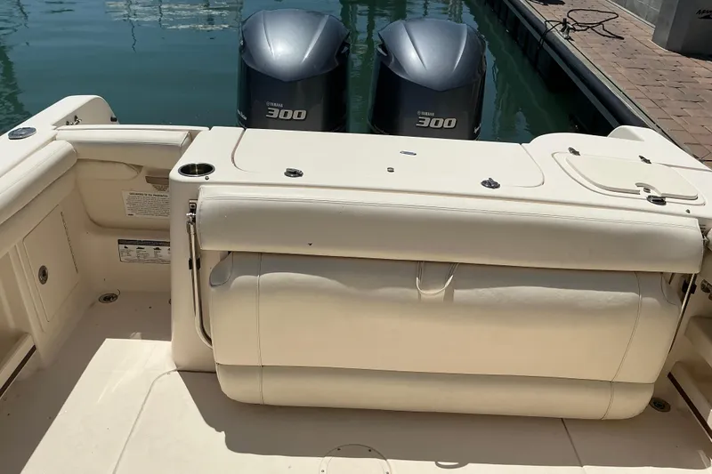 Slide: The Image of 2018 Grady-White Freedom 285 boat with twin Yamaha 300 engines at dock. - 18