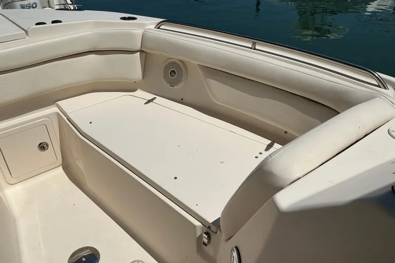 Slide: The Image of 2018 Grady-White Freedom 285 boat interior with seating and storage compartments. - 3