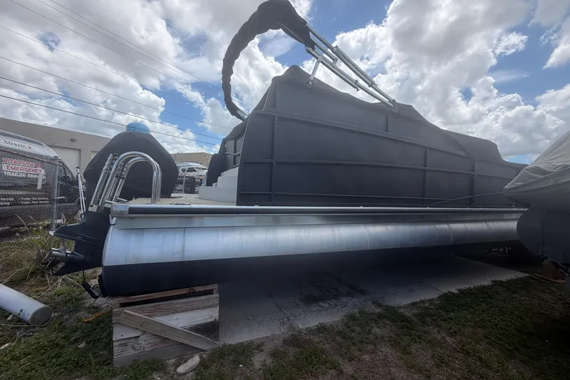 Slide: The Image of 2015 Premier 290 Grand View pontoon boat with luxurious orange seating and spacious deck layout. - 20