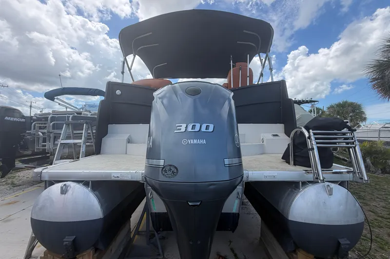 Slide: The Image of Captain's seat and helm of 2015 Premier 290 Grand View boat with Garmin navigation. - 31