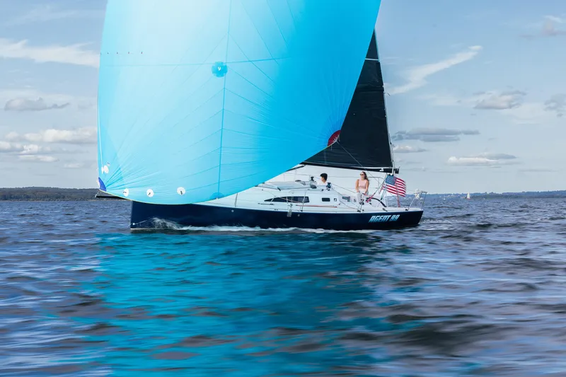 Slide: The Image of 2026 J Boats J/99 sailboat with blue spinnaker on open water. - 5